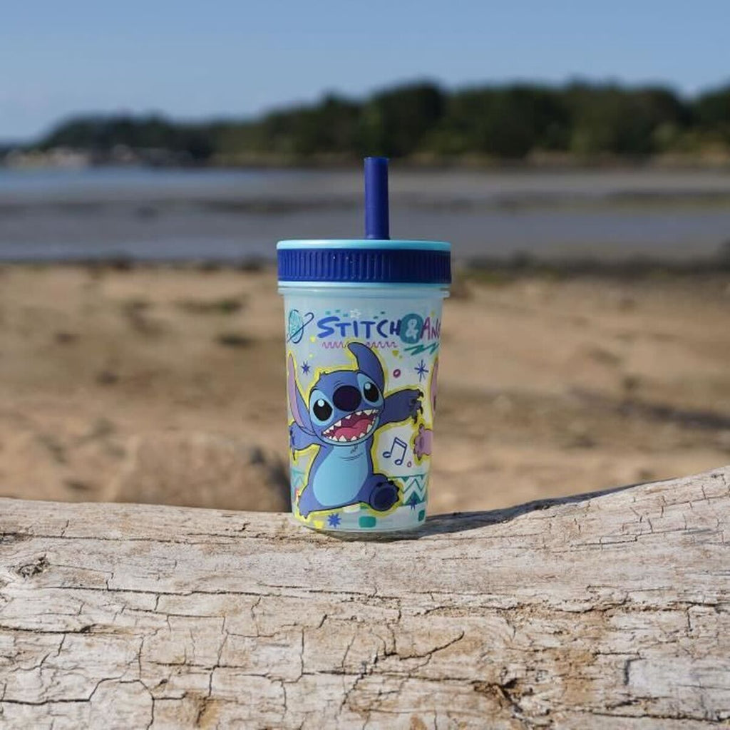 Training Glass ThermoBaby LILO & STITCH 420 ml Blue on a beach backdrop with blue sky.