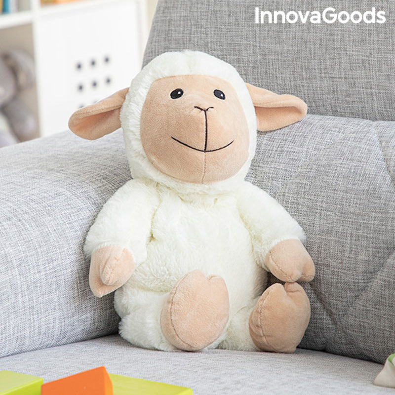 Sheep Soft Toy with Warming and Cooling Effect Wooly InnovaGoods sitting on a sofa, perfect for kids and comfort.