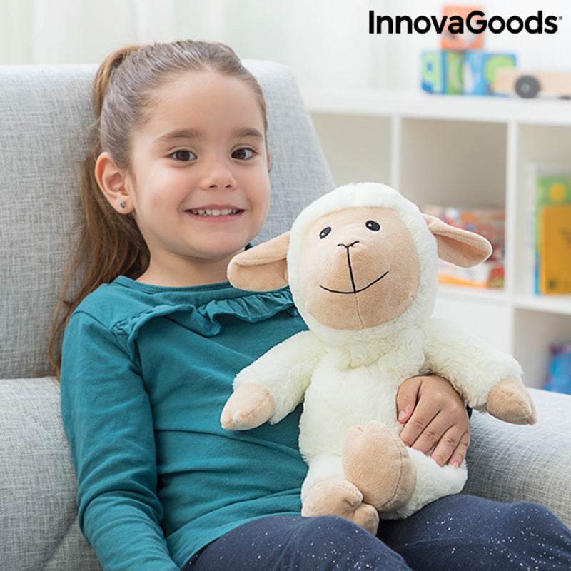 Child enjoying the Sheep Soft Toy with Warming and Cooling Effect Wooly InnovaGoods in a cozy setting.