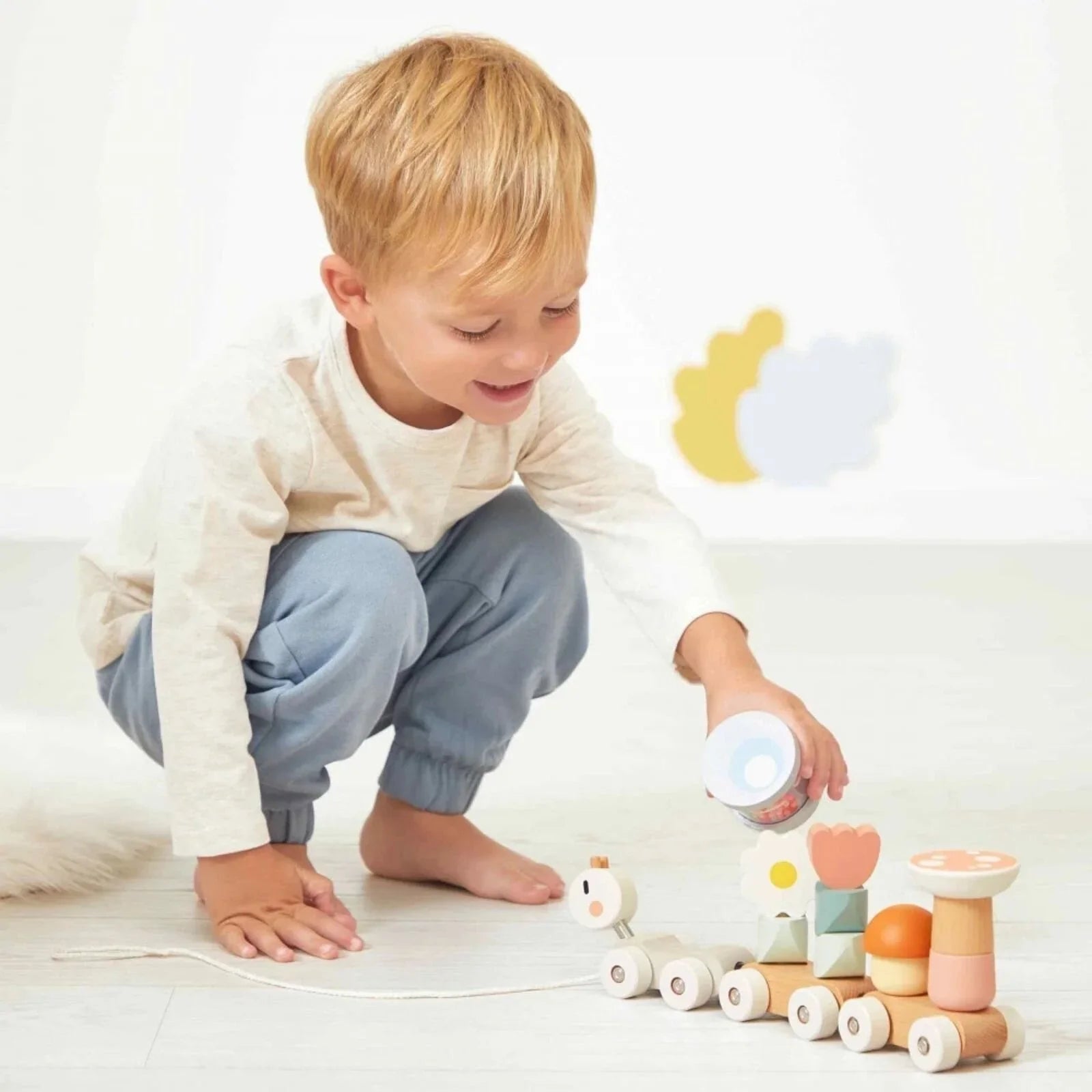 Trên Janod Sweet Cocoon ar ffurf malwen